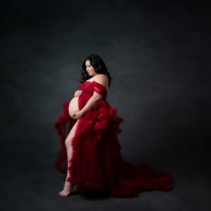 A pregnant woman in a red dress.