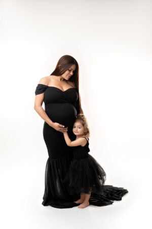A woman and child in black dresses.