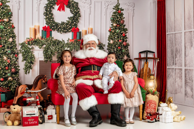 Santa and children in festive Christmas setting